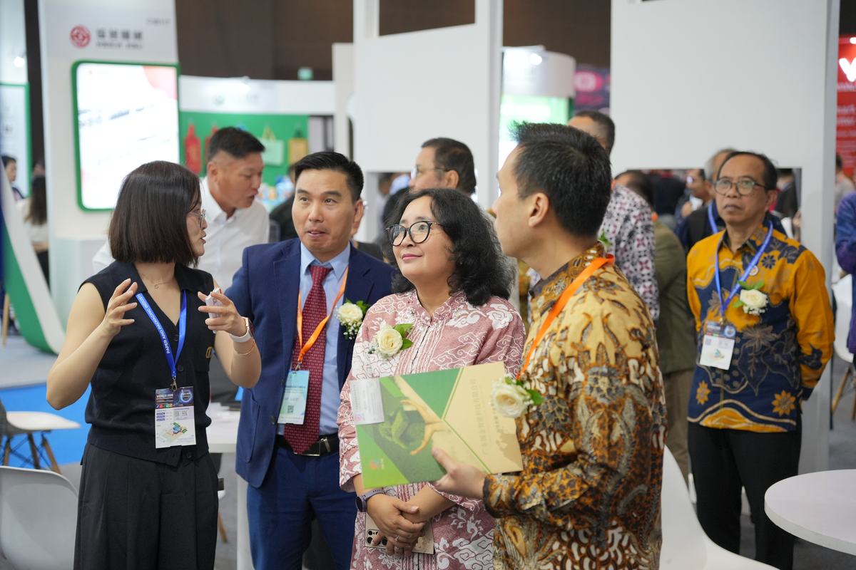 Business visitors networking at an expo booth